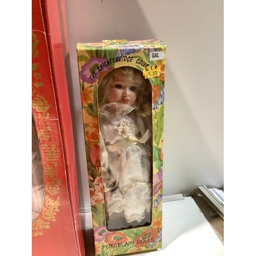 31 - 3 collectible porcelain dolls in boxes