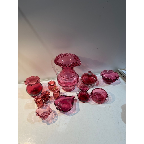 150 - A large collection of cranberry glass in very clean condition