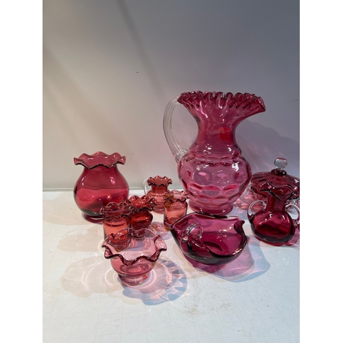 150 - A large collection of cranberry glass in very clean condition