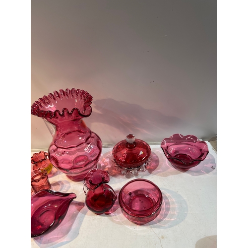 150 - A large collection of cranberry glass in very clean condition