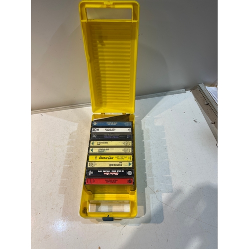 161 - Status quo cassette tapes in yellow shed case