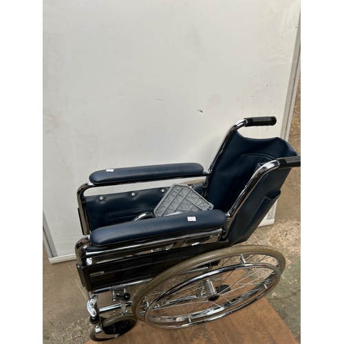 970 - Wheelchair in good condition with footrests