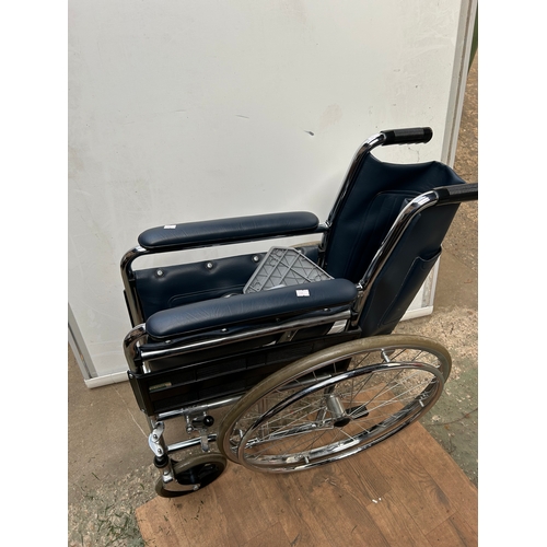 970 - Wheelchair in good condition with footrests