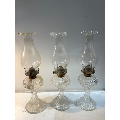 306 - 3 matching glass oil lamps