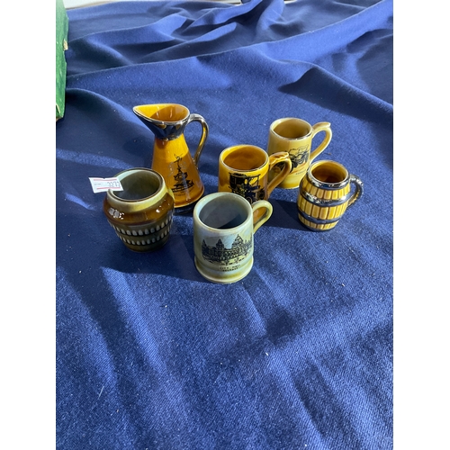 287 - Collection of Wade miniature tankards, miniature jug and miniature pot