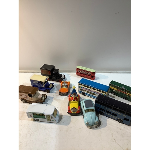 252 - Some play worn cars buses inc bugs bunny noddy vw  makes like  Lledo matchbox days gone etc