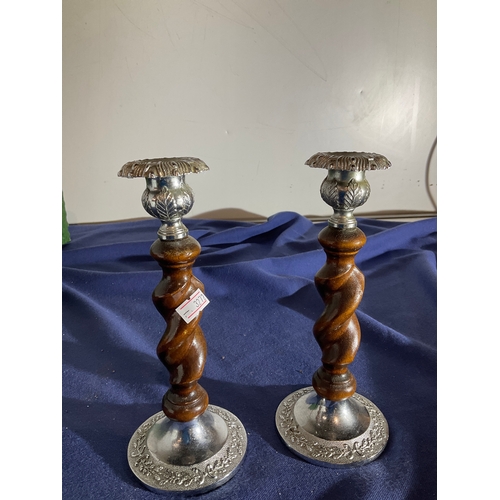 288 - A pair of barley twist wood and decorative metal candle stick