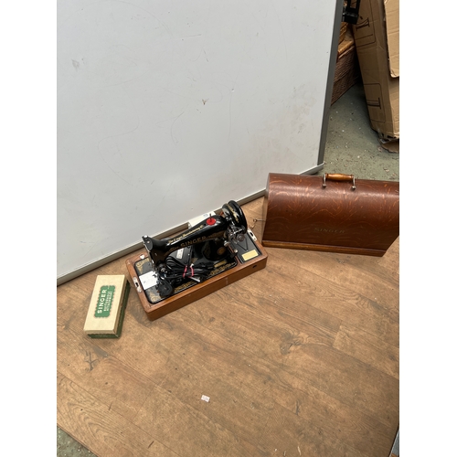 Vintage singer sewing machine with wooden case