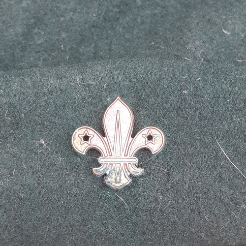 99 - Boy scout beret with cap badge. Shows age. No damage but requires a clean up.