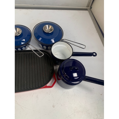 174 - Selection of blue metal saucepans and a cast iron grill