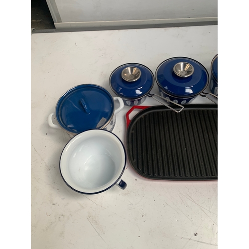 174 - Selection of blue metal saucepans and a cast iron grill