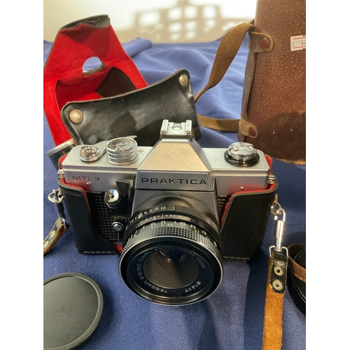 91 - A Praktica MTL3 camera and a pair of Omega binoculars