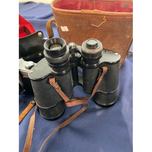 91 - A Praktica MTL3 camera and a pair of Omega binoculars
