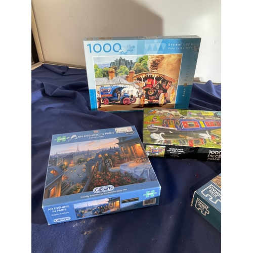 118 - Selection of 5 jigsaw puzzles to include Fishermen’s boats, An Evening in Paris, Steam Loco, Beautif... 