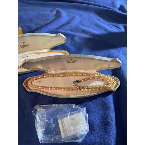 119 - 3 sets of lotus simulated pearls, 2 jewellery boxes and one other chain necklace