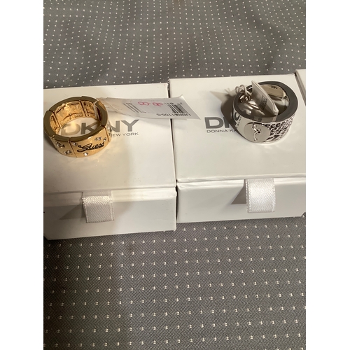 130 - 3 designer rings in Dkny boxes one is dkny diesel and guess