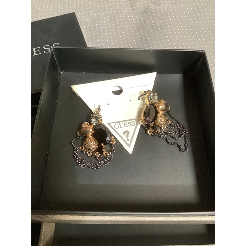 137 - Designer Guess necklace and earrings