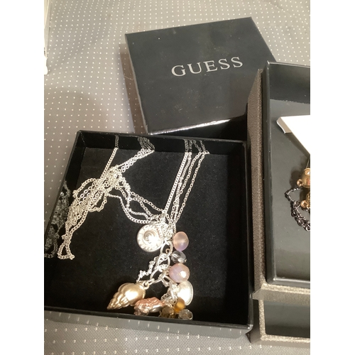 137 - Designer Guess necklace and earrings