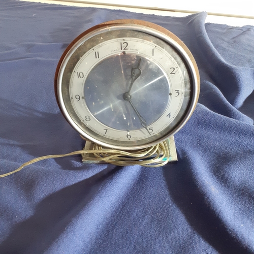 59A - Vintage Temco Electric clock. Heavy iron casing. Sold as spares.