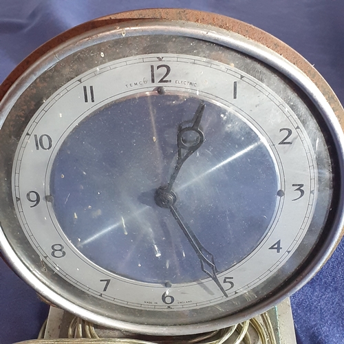 59A - Vintage Temco Electric clock. Heavy iron casing. Sold as spares.