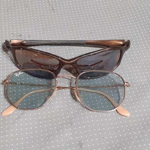 182A - 2 pairs of sunglasses. One genuine Rayban Evolve and O-Luminum Hatchet.