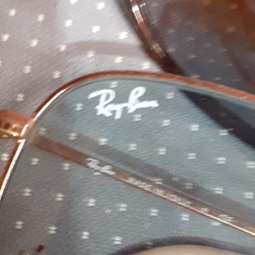 182A - 2 pairs of sunglasses. One genuine Rayban Evolve and O-Luminum Hatchet.