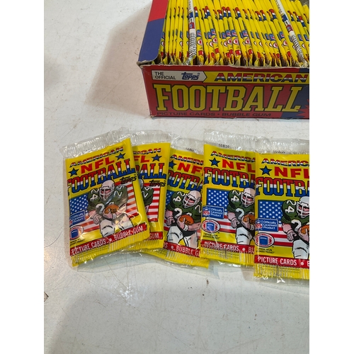 22 - The official Topps American Football picture cards . Bubble gum each sealed packs in a box