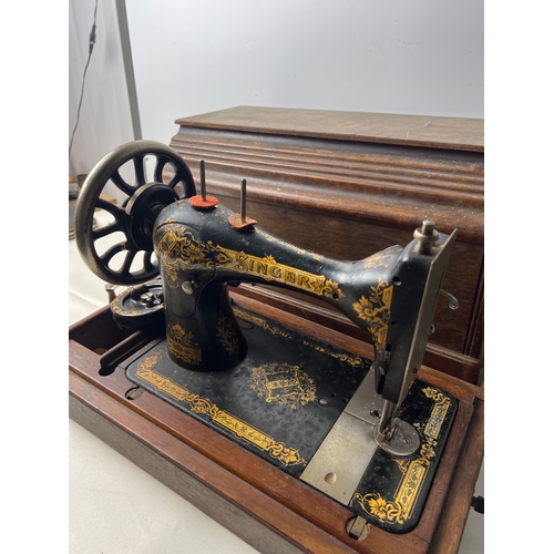 Vintage singer hand crank sewing machine in wood box