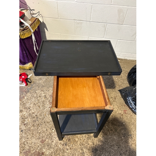 Extendable card playing table, swivels to reveal internal storage
