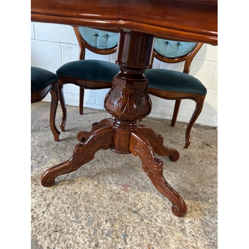 253 - Polished oval dining table with rich wood finish and ornate pedestal base. Paired with six tufted, u... 