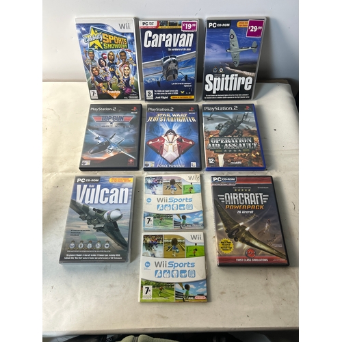214 - Mix of games inc Wii Sports, PC flight games, PS2 inc Top Gun etc