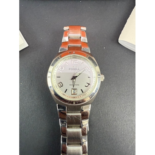 323 - Fossil quartz watch with tin & papers