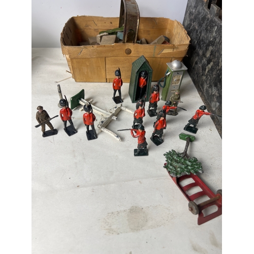 193 - Wooden play castle with quantity of lead Britains soldiers, guard tower and petrol pump