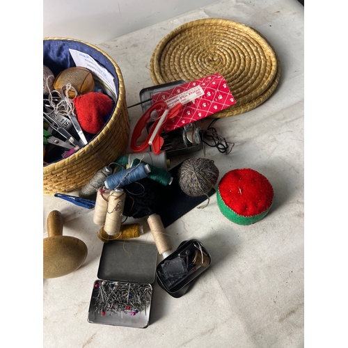 Wicker basket full of sewing Essentials inc thread, needles and more