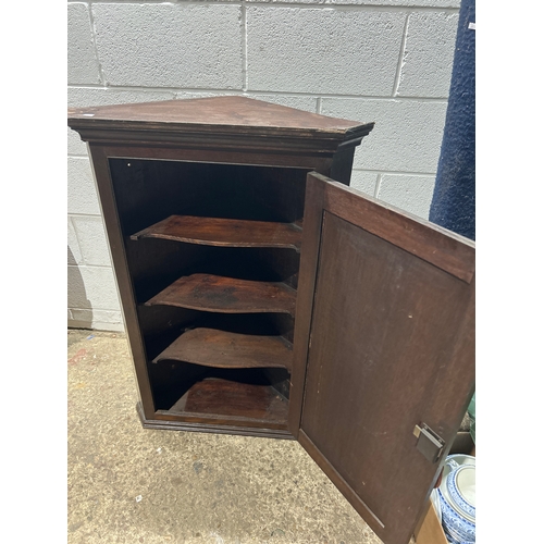 Dark oak triangular wood display cabinet with key