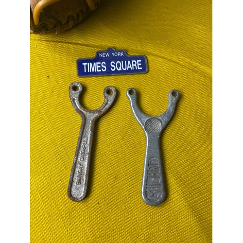 66 - Vintage pair of catapults, baseball glove and New York metal small sign