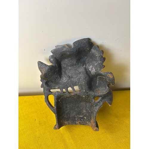 67 - Cast iron door stop of sunflowers in a watering can