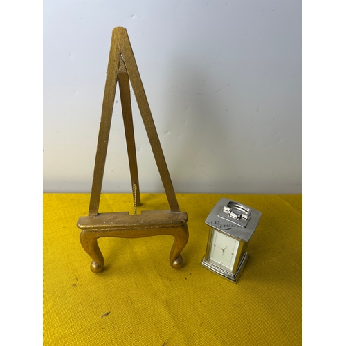 77 - Small open fronted chromed carriage clock and gold colour easel photo frame