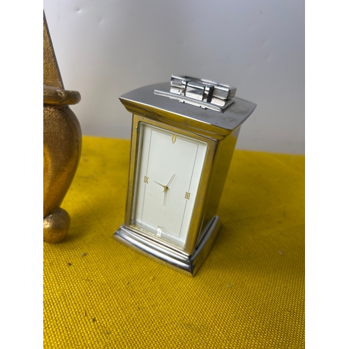 77 - Small open fronted chromed carriage clock and gold colour easel photo frame