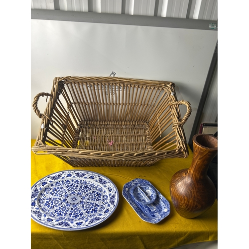 116 - Large wicker basket with meat plate, spode dishes and tall wooden vase