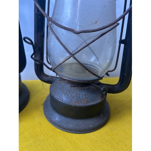 65 - Monarch and one other portable oil lanterns