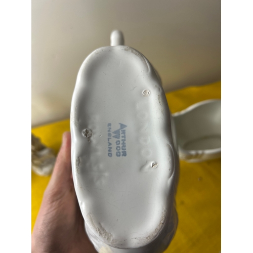 67 - Pair of Arthur wood fluted vases, German figurines and pair of Peroni glass tankards