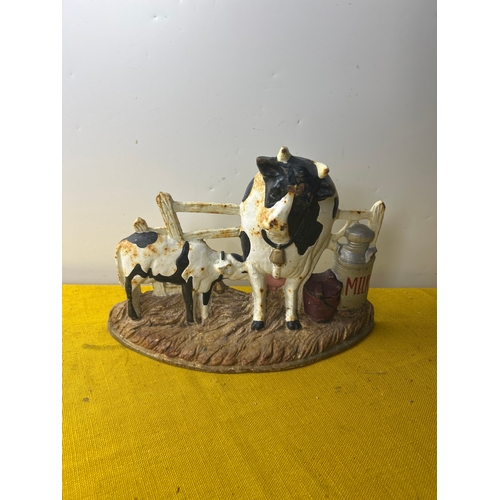 69 - Cast iron cow themed door stop