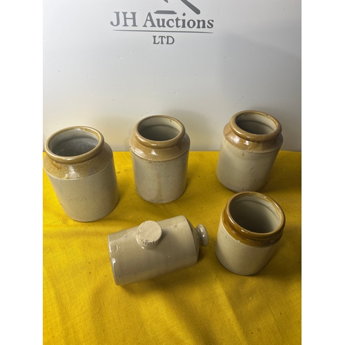 115 - Four stoneware planters and a hot water bottle