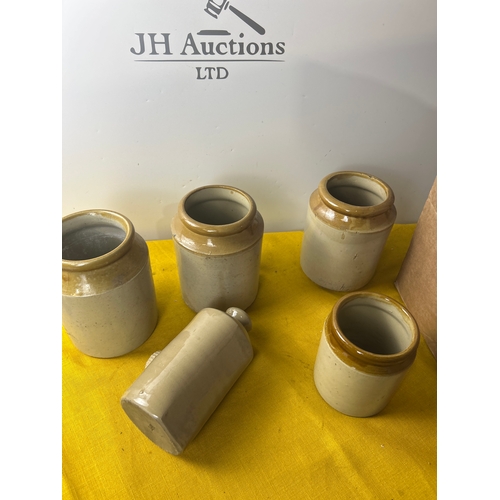 115 - Four stoneware planters and a hot water bottle