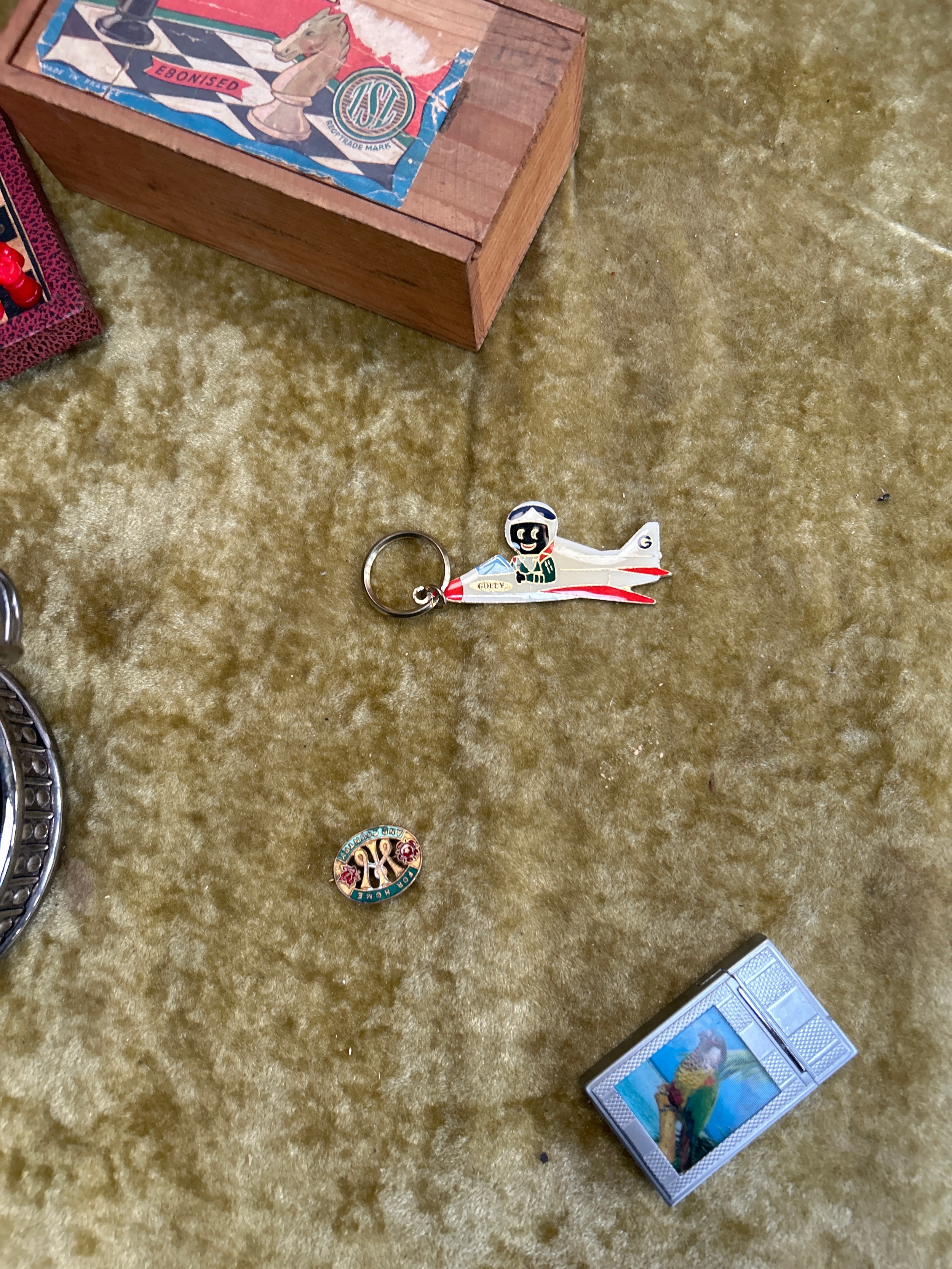 Collectible lot inc golly keychain, lighter, tins, games compendium and ...