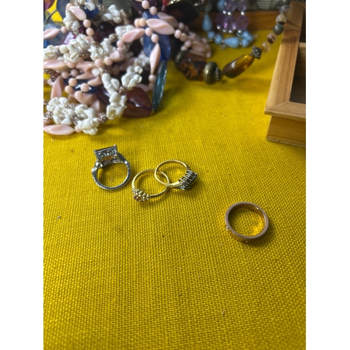 1 - Quantity of costume jewellery in sewing padded box inc costume rings - one is Cartier style