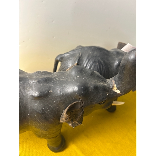 2 - Pair of leather clad decorative elephants with plastic tusks - 35cm long