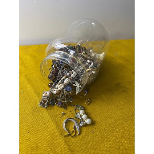 6 - A plastic tub full of various costume jewellery