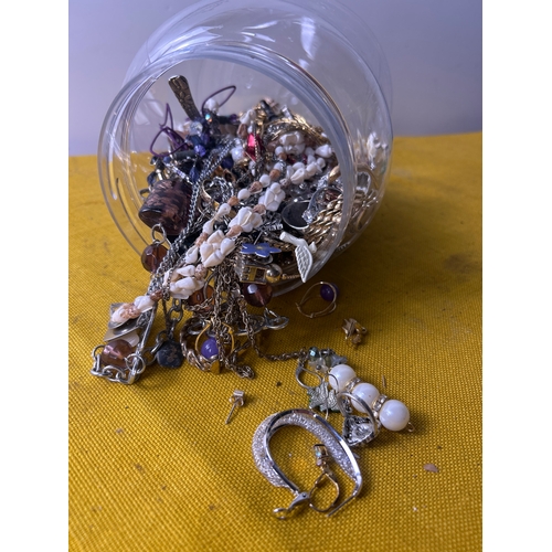 6 - A plastic tub full of various costume jewellery